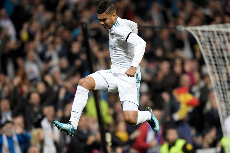 Real Madrid's Brazilian midfielder Casemiro celebrates after scoring a goal during the Spanish league football match Real Madrid CF vs UD Las Palmas at the Santiago Bernabeu stadium in Madrid on November 5, 2017. / AFP PHOTO / GABRIEL BOUYS (Photo