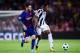 BARCELONA, SPAIN - SEPTEMBER 12: Lionel Messi of FC Barcelona competes for the ball with Alex Sandro of Juventus during the UEFA Champions League group D match between FC Barcelona and Juventus at Camp Nou on September 12, 2017 in Barcelona, Spain. (Pho