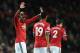 Manchester United's French midfielder Paul Pogba (L) celebrates scoring Manchester United's English defender Chris Smalling scored thier second goal during the English Premier League football match between Manchester United and Newcastle at Old Trafford i