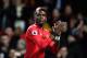 MANCHESTER, ENGLAND - NOVEMBER 18: Paul Pogba of Manchester United celebrates when Romelu Lukaku (not pictured) scores their sides fourth goal during the Premier League match between Manchester United and Newcastle United at Old Trafford on November 18,