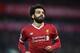 Liverpool's Egyptian midfielder Mohamed Salah celebrates scoring his team's first goal during the English Premier League football match between Liverpool and Southampton at Anfield in Liverpool, north west England on November 18, 2017. / AFP PHOTO / Paul
