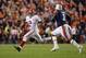 AUBURN, AL - NOVEMBER 25: Jalen Hurts #2 of the Alabama Crimson Tide is pursued by Marlon Davidson #3 of the Auburn Tigers during the fourth quarter of the game at Jordan Hare Stadium on November 25, 2017 in Auburn, Alabama. (Photo by Kevin C. Cox/Getty