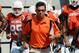 Gundy leading his team out before the "I'm 40" game in 2007.