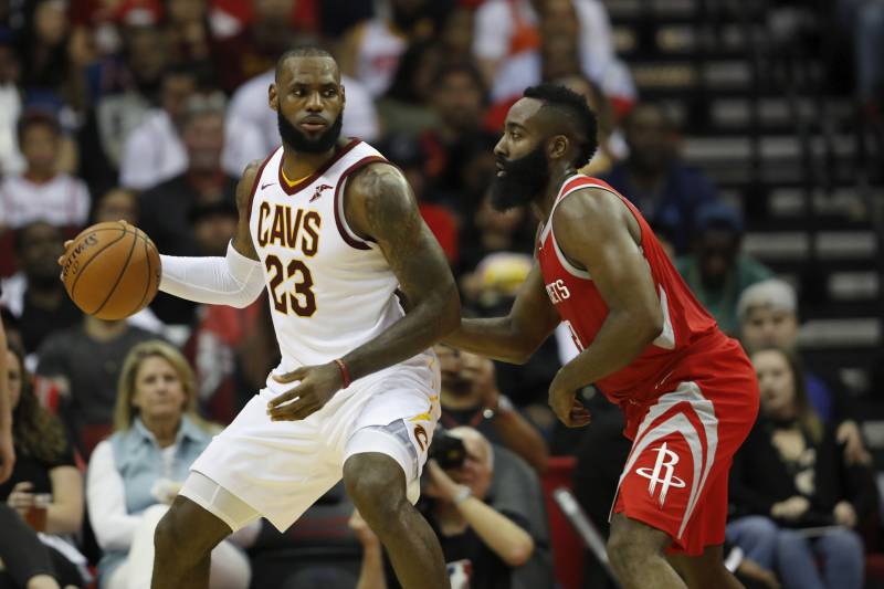 HOUSTON, TX - NOVEMBER 09: LeBron James #23 of the Cleveland Cavaliers controls the ball against James Harden #13 of the Houston Rockets in the first half at Toyota Center on November 09, 2017 in Houston, Texas. NOTE TO USER: User expressly acknowledges