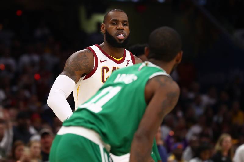 CLEVELAND, OH - OCTOBER 17: LeBron James #23 of the Cleveland Cavaliers goes to greet Kyrie Irving #11 of the Boston Celtics prior to playing at at Quicken Loans Arena on October 17, 2017 in Cleveland, Ohio. NOTE TO USER: User expressly acknowledges and