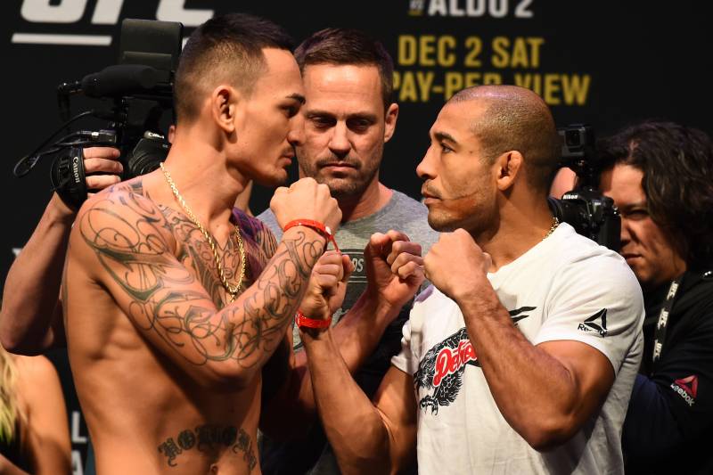DETROIT, MI - DECEMBER 01: (L-R) Max Holloway and Jose Aldo of Brazil face off during the UFC 218 weigh-in inside Little Caesars Arena on December 1, 2017 in Detroit, Michigan. (Photo by Josh Hedges/Zuffa LLC/Zuffa LLC via Getty Images)