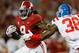 TUSCALOOSA, AL - SEPTEMBER 30: Bo Scarbrough #9 of the Alabama Crimson Tide rushes away from Marquis Haynes #38 of the Mississippi Rebels at Bryant-Denny Stadium on September 30, 2017 in Tuscaloosa, Alabama. (Photo by Kevin C. Cox/Getty Images)
