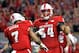 RALEIGH, NC - NOVEMBER 25: Will Richardson #54 of the North Carolina State Wolfpack celebrates with Nyheim Hines #7 of the North Carolina State Wolfpack after Hines' touchdown against the North Carolina Tar Heels during their game at Carter Finley Stadiu
