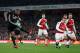 Manchester United's Ecuadorian midfielder Antonio Valencia (L) scores the opening goal during the English Premier League football match between Arsenal and Manchester United at the Emirates Stadium in London on December 2, 2017. / AFP PHOTO / Adrian DENN