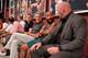 WME CEO Ari Ari Emanuel sitting next to UFC champion Demetrious Johnson and Dana White.