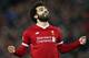 LIVERPOOL, ENGLAND - DECEMBER 06: Mohamed Salah of Liverpool celebrates after scoring his sides sixth goal during the UEFA Champions League group E match between Liverpool FC and Spartak Moskva at Anfield on December 6, 2017 in Liverpool, United Kingdom.