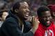 Meek Mill (left) and actor Kevin Hart at a Sixers game.