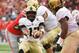 COLUMBUS, OH - SEPTEMBER 16: Ahmad Bradshaw #17 of the Army Golden Knights tosses the ball to a back in the first quarter against the Ohio State Buckeyes at Ohio Stadium on September 16, 2017 in Columbus, Ohio. (Photo by Jamie Sabau/Getty Images)