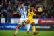 HUDDERSFIELD, ENGLAND - DECEMBER 09: Christopher Schindler of Huddersfield Towntackles Jose Izquierdo of Brighton and Hove Albion during the Premier League match between Huddersfield Town and Brighton and Hove Albion at John Smith's Stadium on December 9