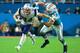 MIAMI GARDENS, FL - DECEMBER 11: Rex Burkhead #34 of the New England Patriots tries to avoid the tackle from Kiko Alonso #47 of the Miami Dolphins during the second quarter at Hard Rock Stadium on December 11, 2017 in Miami Gardens, Florida. (Photo by Ch