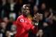 MANCHESTER, ENGLAND - NOVEMBER 18: Paul Pogba of Manchester United celebrates when Romelu Lukaku (not pictured) scores their sides fourth goal during the Premier League match between Manchester United and Newcastle United at Old Trafford on November 18,