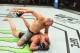 WINNIPEG, CANADA - DECEMBER 16: Glover Teixeira of Brazil (top) punches Misha Cirkunov of Latvia in their light heavyweight bout during the UFC Fight Night event at Bell MTS Place on December 16, 2017 in Winnipeg, Manitoba, Canada. (Photo by Josh Hedges/