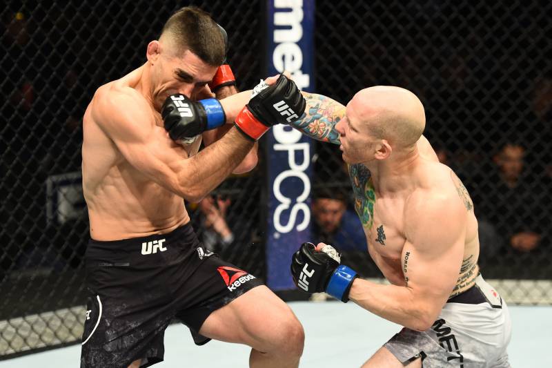 WINNIPEG, CANADA - DECEMBER 16: (R-L) Josh Emmett punches Ricardo Lamas in their featherweight bout during the UFC Fight Night event at Bell MTS Place on December 16, 2017 in Winnipeg, Manitoba, Canada. (Photo by Josh Hedges/Zuffa LLC/Zuffa LLC via Getty