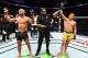 Dos Anjos gets his hand raised after a hard fought win over Lawler.