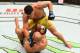 Dos Anjos pours it on Lawler on the ground.