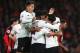 BOURNEMOUTH, ENGLAND - DECEMBER 17: Roberto Firmino of Liverpool joins in Dejan Lovren's celebrations with teammates Georginio Wijnaldum and Philippe Coutinho after scoring his sides second goal during the Premier League match between AFC Bournemouth an