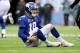 EAST RUTHERFORD, NJ - DECEMBER 17: Eli Manning #10 of the New York Giants lays on the ground after a play against the Philadelphia Eagles during the second quarter in the game at MetLife Stadium on December 17, 2017 in East Rutherford, New Jersey. (Phot