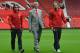 Manchester United's Dutch manager Louis van Gaal (C) poses for photographs along with the club's latest signings Colombian striker Radamel Falcao (L) and Dutch midfielder Daley Blind (R) during their unveiling at Old Trafford in Manchester on September 11