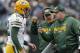 Green Bay Packers head coach Mike McCarthy talks with quarterback Aaron Rodgers during Sunday's 31-24 loss to the Carolina Panthers.