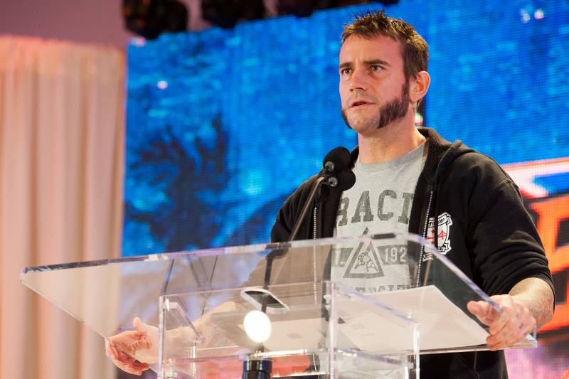 CM Punk speaks at a SummerSlam press conference in 2013.
