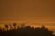 MONTECITO, CA - DECEMBER 16: Smoke fills the sky over the ocean beyond homes threatened by the Thomas Fire on December 16, 2017 in Montecito, California. The National Weather Service has issued red flag warnings of dangerous fire weather in Southern Calif