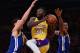 LOS ANGELES, CA - DECEMBER 18: Julius Randle #30 of the Los Angeles Lakers drives between Klay Thompson #11 and Andre Iguodala #9 during a 116-114 Warrior overtime win at Staples Center on December 18, 2017 in Los Angeles, California. (Photo by Harry Ho