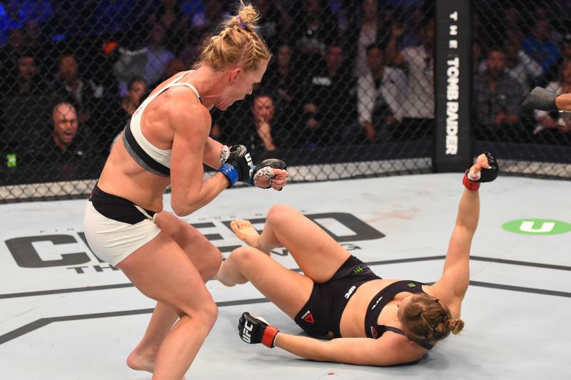 Holm drops Rousey with a head kick during their fight at UFC 193.