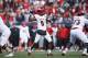 JACKSONVILLE, FL - DECEMBER 30: Lamar Jackson #8 of the Louisville Cardinals looks to pass against the Mississippi State Bulldogs during the TaxSlayer Bowl at EverBank Field on December 30, 2017 in Jacksonville, Florida. The Bulldogs won 31-27. (Photo by