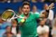 PERTH, AUSTRALIA - JANUARY 03: Thanasi Kokkinakis of Australia plays a forehand in the mixed doubles match against Elise Mertens and David Goffin of Belgium on day five of the 2018 Hopman Cup at Perth Arena on January 3, 2018 in Perth, Australia. (Photo