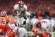 NEW ORLEANS, LA - JANUARY 01: Damien Harris #34 of the Alabama Crimson Tide dives with the ball as Van Smith #23 of the Clemson Tigers defends in the second half of the AllState Sugar Bowl at the Mercedes-Benz Superdome on January 1, 2018 in New Orleans,