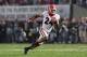 PASADENA, CA - JANUARY 01: Safety Dominick Sanders #24 of the Georgia Bulldogs runs with the ball for 39-yards after an interception in the second half against the Oklahoma Sooners in the 2018 College Football Playoff Semifinal at the Rose Bowl Game pres