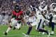 LOS ANGELES, CA - JANUARY 06: Running back Devonta Freeman #24 of the Atlanta Falcons carries the ball in front of cornerback Troy Hill #32 of the Los Angeles Rams during the fourth quarter of the NFC Wild Card Playoff game at Los Angeles Coliseum on Jan