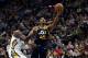 SALT LAKE CITY, UT - JANUARY 03: Donovan Mitchell #45 of the Utah Jazz shoots the ball while being defended by Jrue Holiday #11 of the New Orleans Pelicans during their game at Vivint Smart Home Arena on January 3, 2018 in Salt Lake City, Utah. NOTE TO US