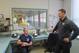 Miocic (right) talks to another firefighter at the Valley View Fire Department.