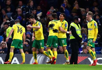 LONDON, ENGLAND - JANUARY 17:  Norwich City celebrate after Jamal Lewis of Norwich City scores his sides first goal during The Emirates FA Cup Third Round Replay between Chelsea and Norwich City at Stamford Bridge on January 17, 2018 in London, England.  