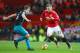 MANCHESTER, ENGLAND - DECEMBER 30: Luke Shaw of Manchester United is faced by James Ward-Prowse of Southampton during the Premier League match between Manchester United and Southampton at Old Trafford on December 30, 2017 in Manchester, England. (Photo