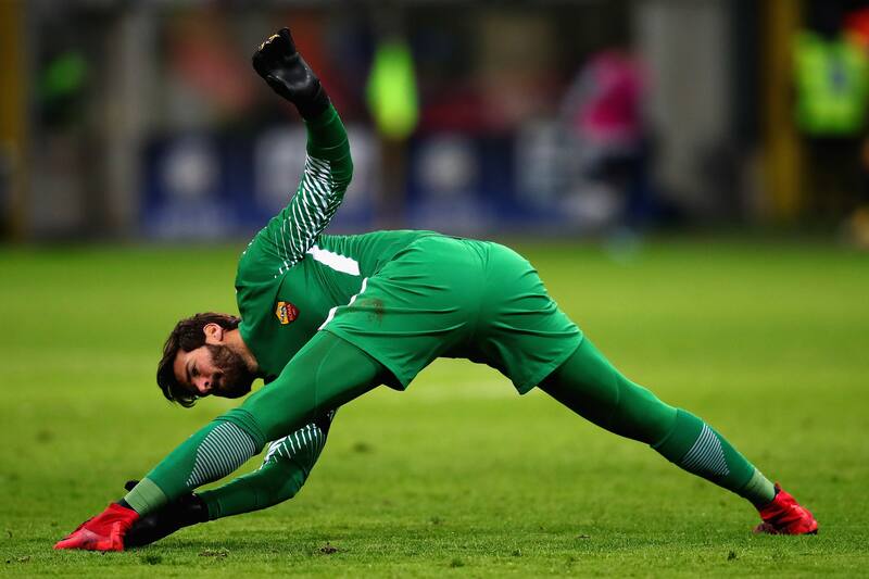 MILAN, ITALY - JANUARY 21: Alisson of AS Roma stretches during the Serie A match between FC Internazionale and AS Roma at Stadio Giuseppe Meazza on January 21, 2018 in Milan, Italy. (Photo by Chris Brunskill Ltd/Getty Images)