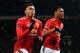 Manchester United's English midfielder Jesse Lingard (L) celebrates scoring the opening goal during the English FA Cup third round football match between Manchester United and Derby County at Old Trafford in Manchester, north west England, on January 5, 2