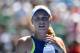 Denmark's Caroline Wozniacki reacts after a point against Belgium's Elise Mertens during their women's singles semi-finals match on day 11 of the Australian Open tennis tournament in Melbourne on January 25, 2018. / AFP PHOTO / SAEED KHAN / -- IMAGE RESTR