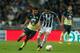 Jonathan Gonzalez (R) of Monterrey is marked by Argentine Oribe Peralta (L) of America during their Mexican Apertura football tournament match at the BBVA Bancomer stadium in Monterrey, Mexico, on October 28, 2017. / AFP PHOTO / Julio Cesar AGUILAR