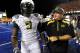 BOISE, ID - SEPTEMBER 3: LaGarrette Blount #9 of the Oregon Ducks is escorted off the field by head coach Chip Kelly after Blount punched a Boise State Broncos player on September 3, 2009 at Bronco Stadium in Boise, Idaho. Boise State defeated Oregon 19-