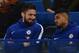 Newly-signed Chelsea striker Olivier Giroud (L) sits with the team before the English Premier League football match between Chelsea and Bournemouth at Stamford Bridge in London on January 31, 2018. / AFP PHOTO / Glyn KIRK / RESTRICTED TO EDITORIAL USE. No