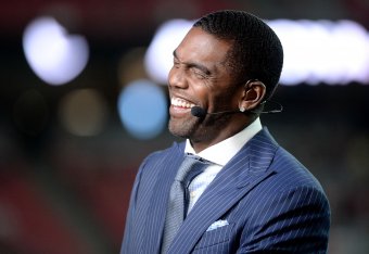 GLENDALE, AZ - SEPTEMBER 25:  ESPN analysts Randy Moss smiles on set during the MNF broadcast prior to the NFL game between the Dallas Cowboys and Arizona Cardinals at University of Phoenix Stadium on September 25, 2017 in Glendale, Arizona.  (Photo by Je