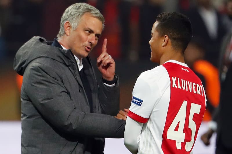 Manchester United's Portuguese manager Jose Mourinho (L) spaeks with Ajax Dutch forward Justin Kluivert after the UEFA Europa League final football match Ajax Amsterdam v Manchester United on May 24, 2017 at the Friends Arena in Solna outside Stockholm. /