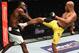 Silva lands a kick on Derek Brunson during their fight at UFC 208.